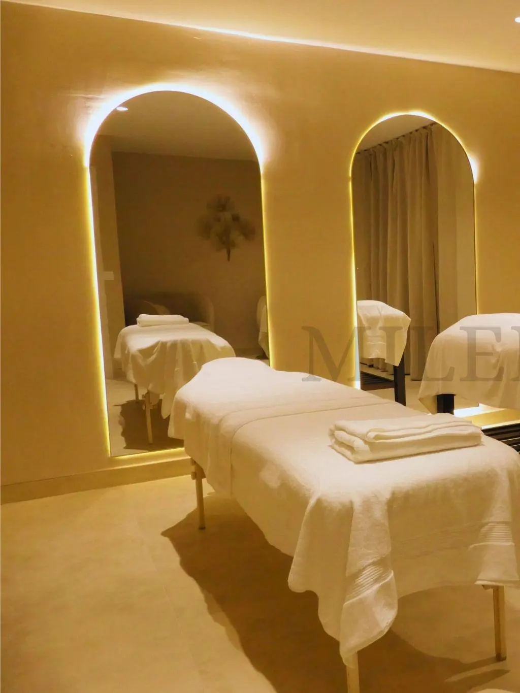 Left view: Couple's massage room with dual treatment beds, Malaga spa