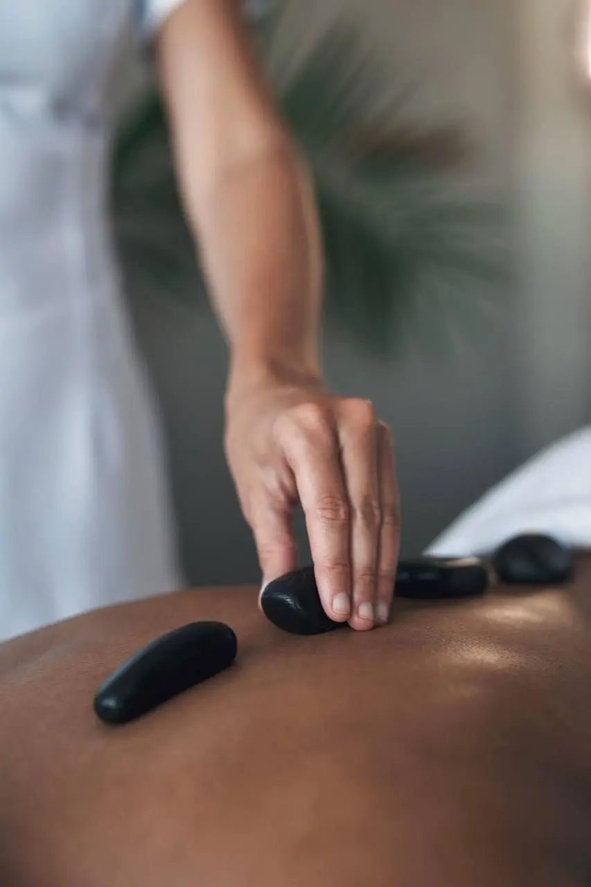 Hot stone massage Marbella - therapeutic stone treatment at wellness center Costa del Sol